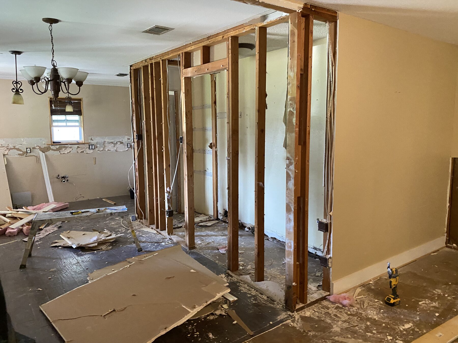 The same kitchen opened to the studs before renovation — Lower Greenville, Dallas TX