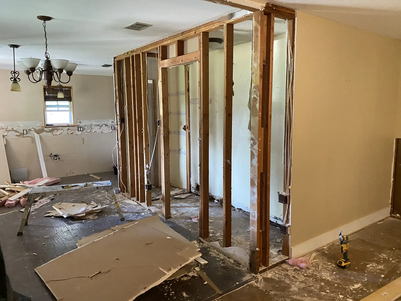 The same kitchen opened to the studs before renovation — Lower Greenville, Dallas TX