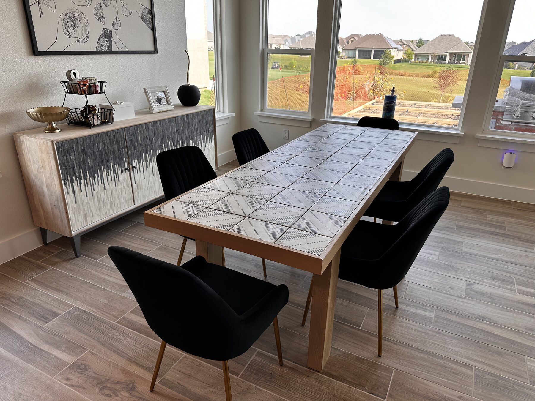 Living and dining space with wood-look plank tile flooring — Trinity Groves, Dallas TX